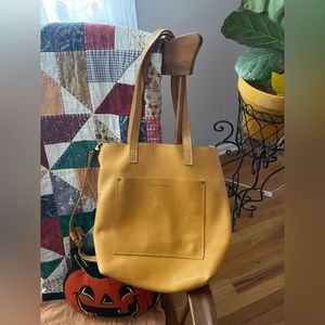 Portland leather crossbody tote in the color sunflower!